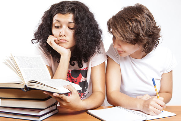 Students reading and writing together